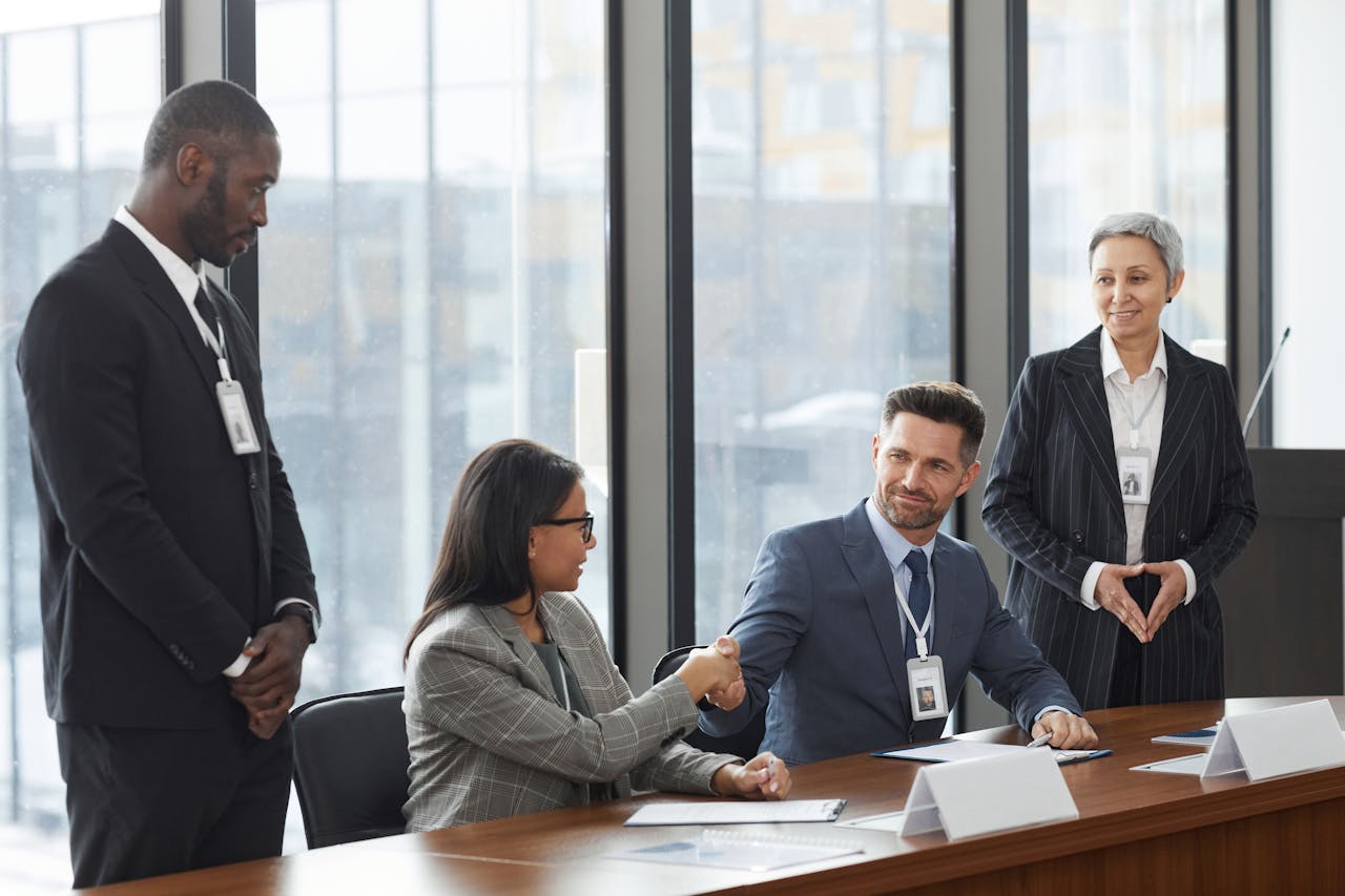Business professionals shaking hands during a meeting